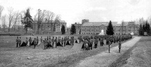 ROTC Cadets standby for inspection of their encampments and equipment, 1919. Hawley Armory is in the background. Laurel Hall now stands on the site of the parade field