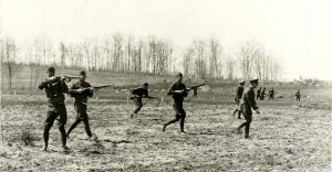 Cadets conducting a "mock battle" on campus, WWI era.