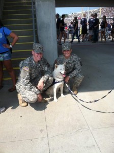 Cadet Lieutenants Nick Hurley (hmm..the name sounds familiar!) and Ashley Cuprak, both CLAS ’13, pose with Jonathan the Husky during a UConn football game at Rentschler Field in 2011.