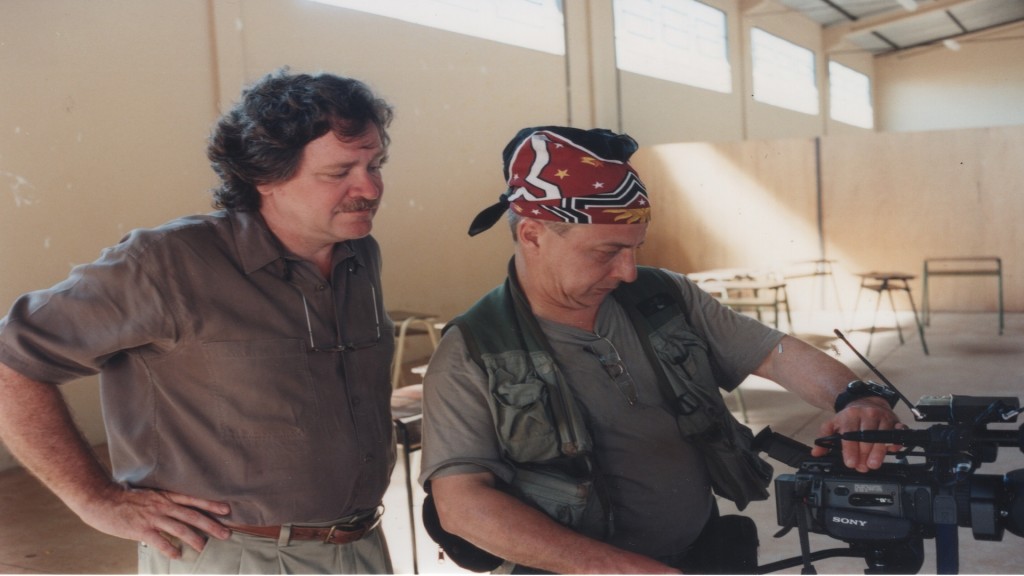 Len Morris, left, and Robin Romano filming at a school in Brazil.